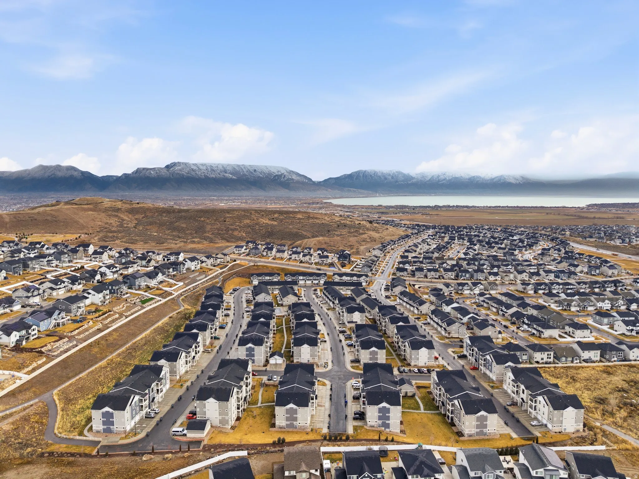 Aerial view of residential area featuring mountains