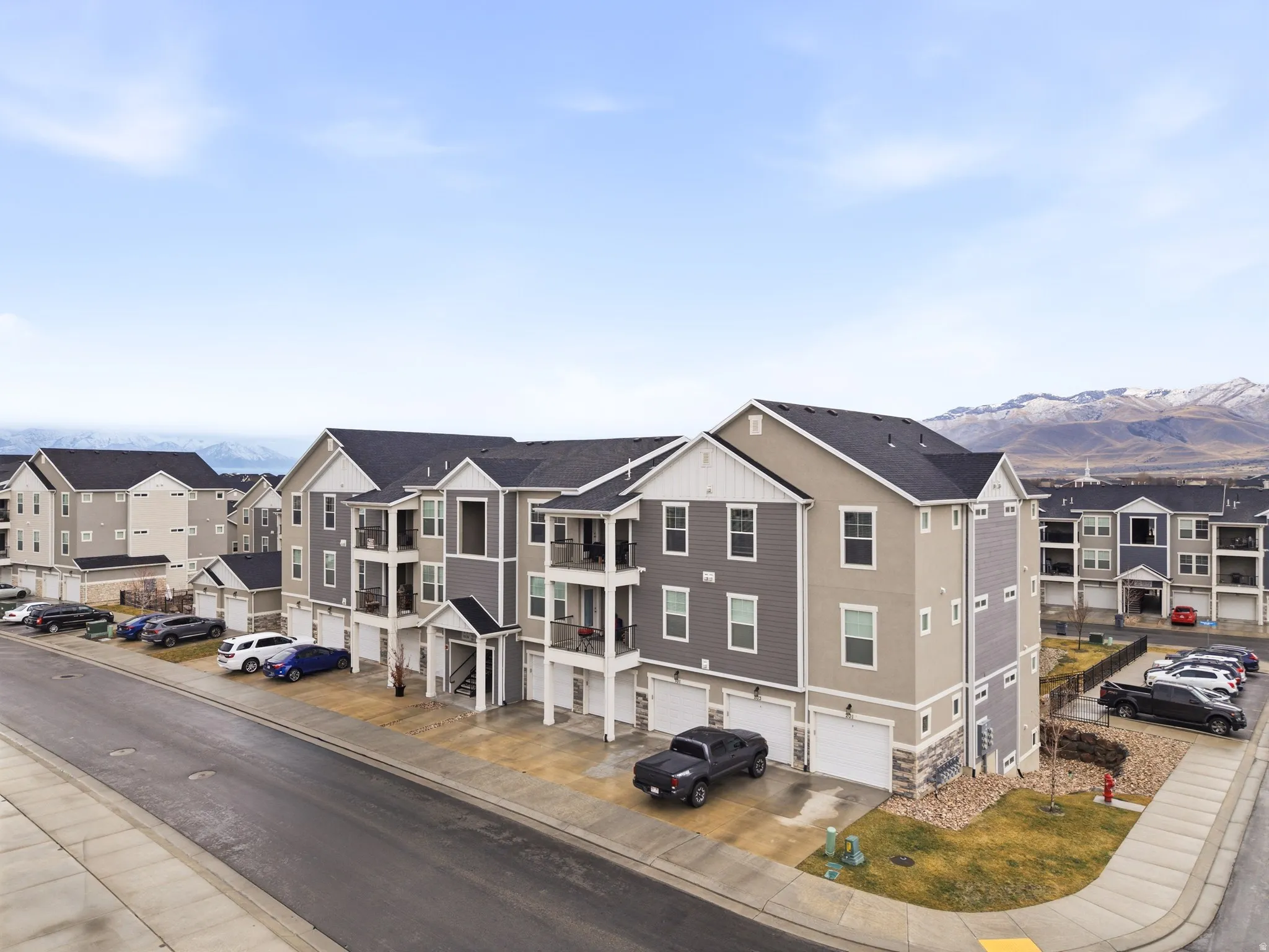 View of asphalt street with sidewalks, a residential view