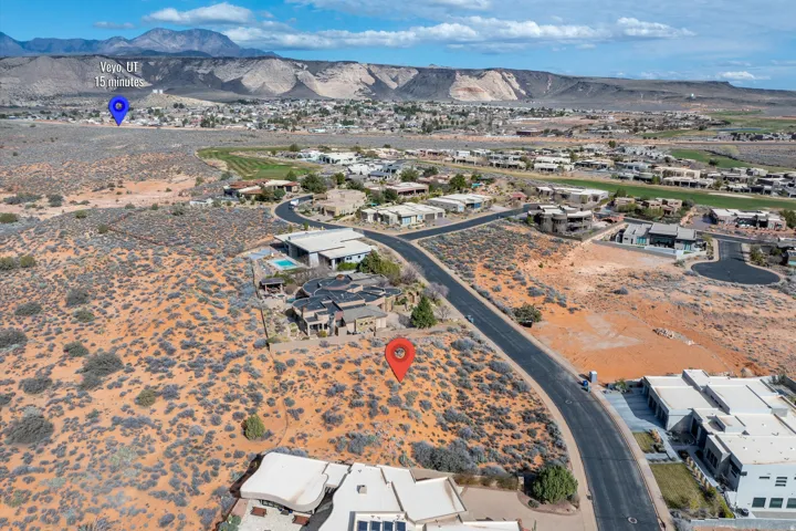 Aerial perspective of suburban area with a mountainous background