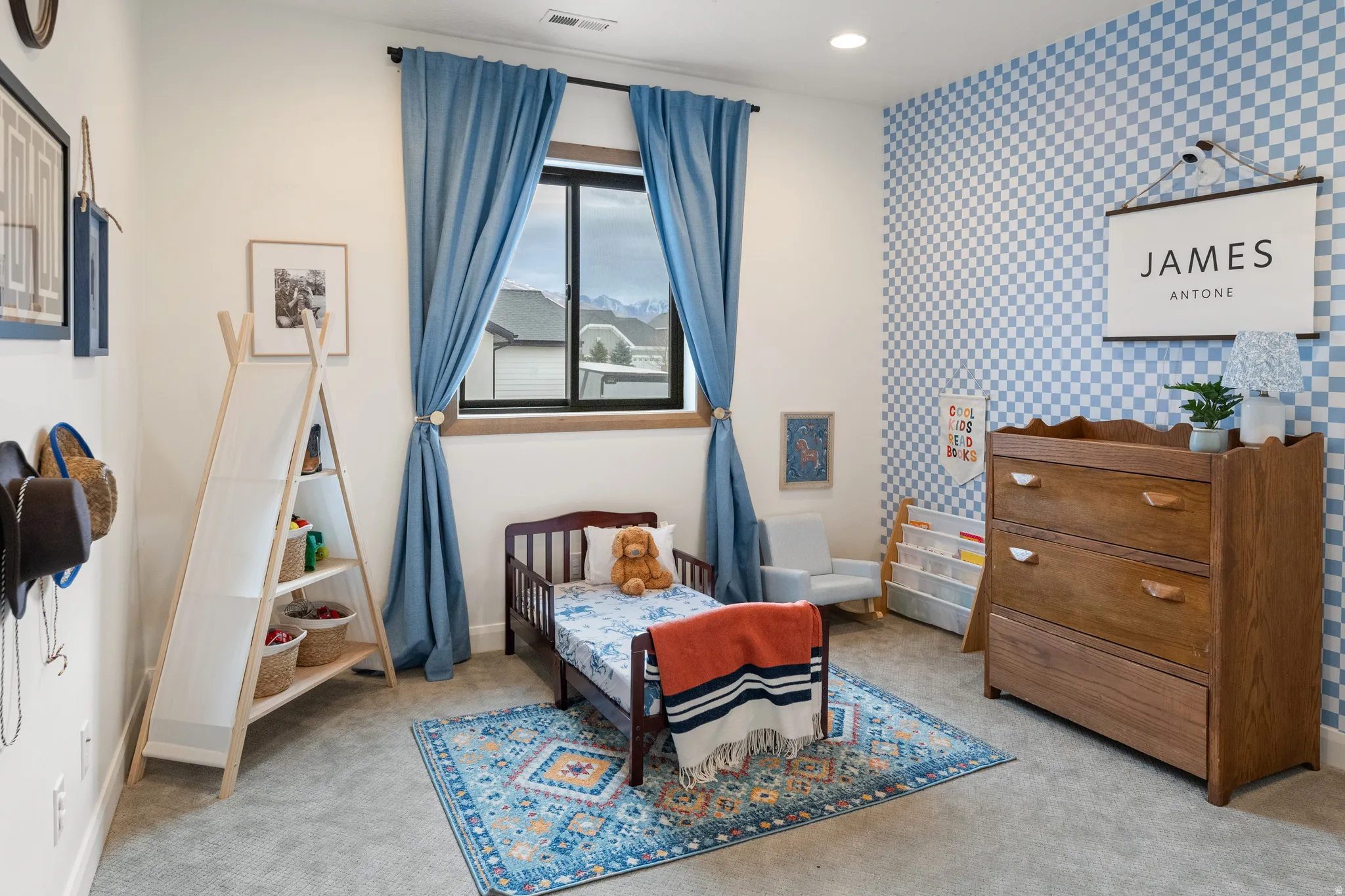 Bedroom 3 featuring wallpapered walls, light colored carpet, an accent wall, and recessed lighting