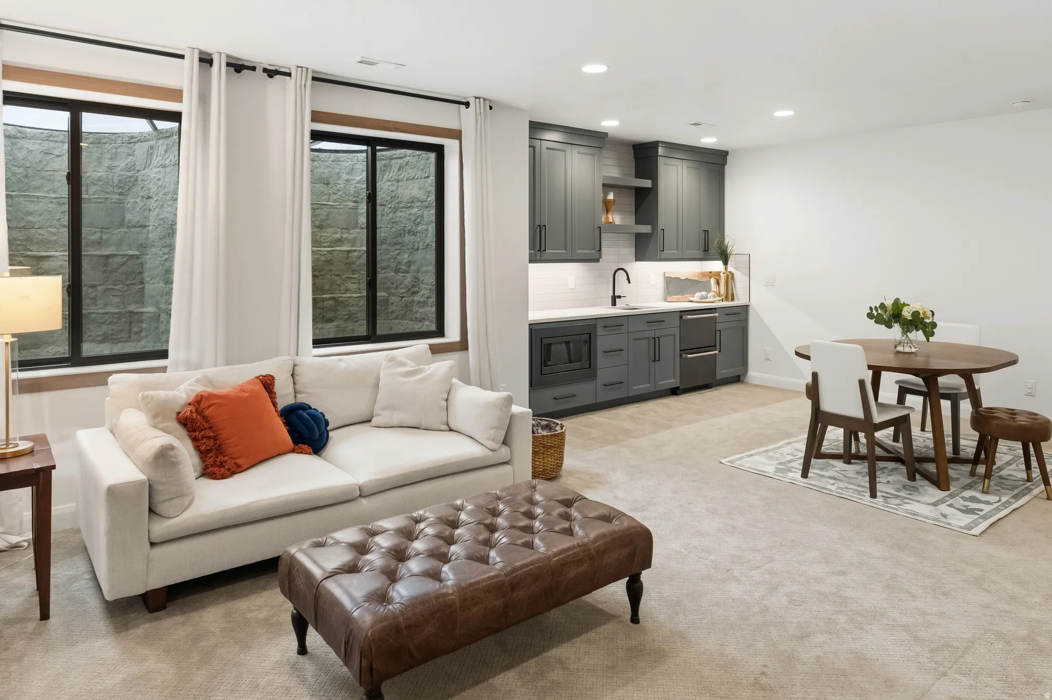 Family room with kitchenette, dining area and recessed lighting