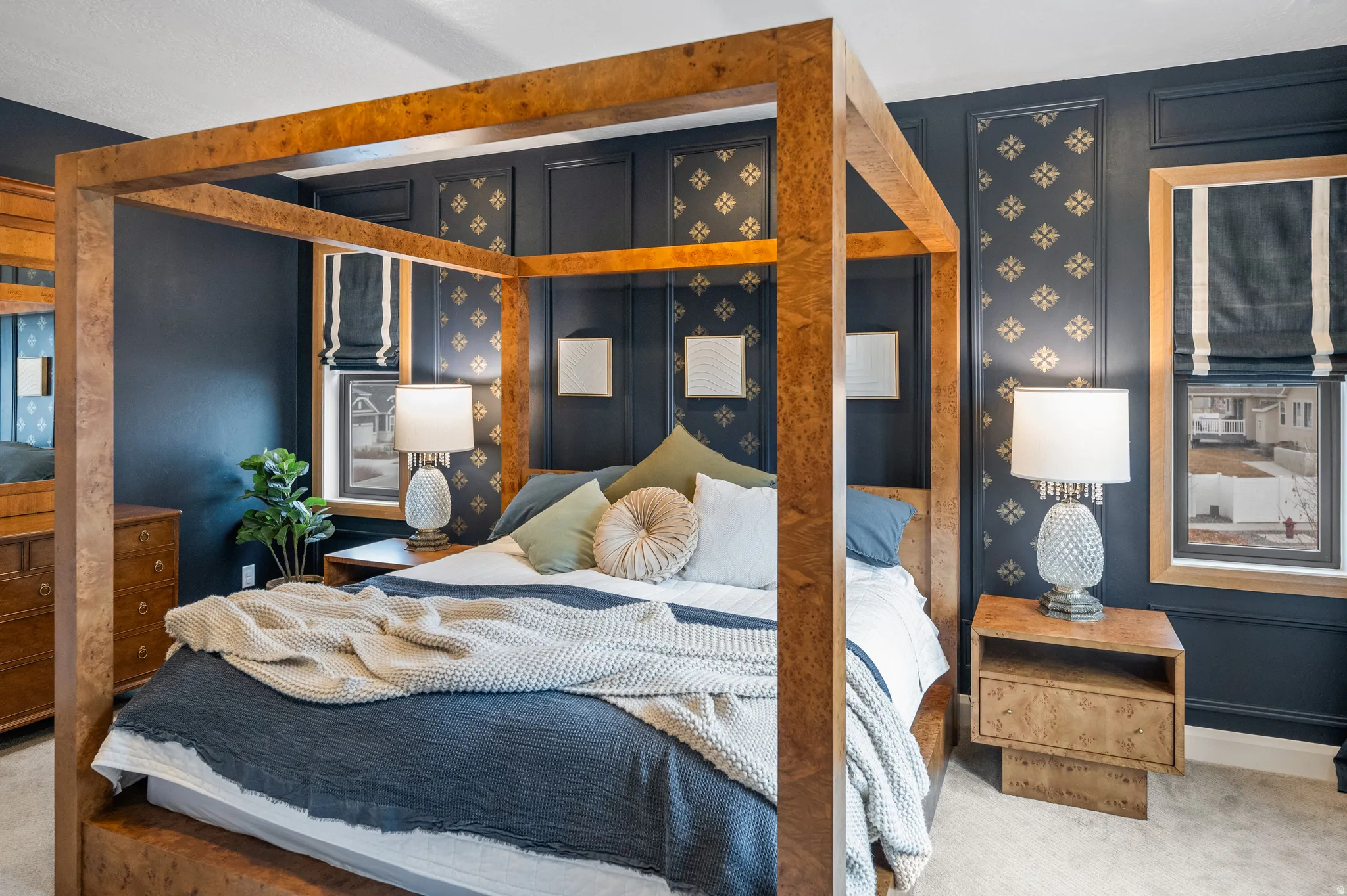 Primary bedroom with richly appointed features, mountain views and white oak window casings