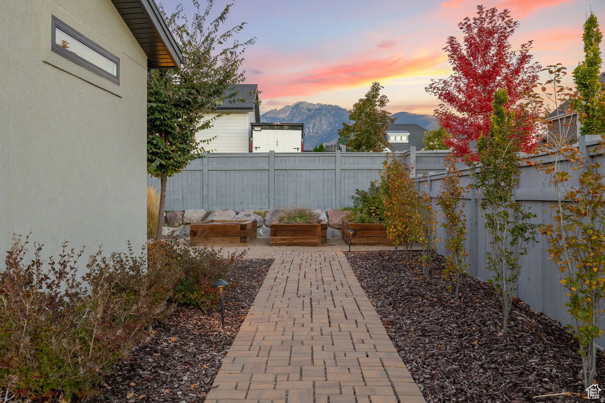 Fenced backyard with a mountain view