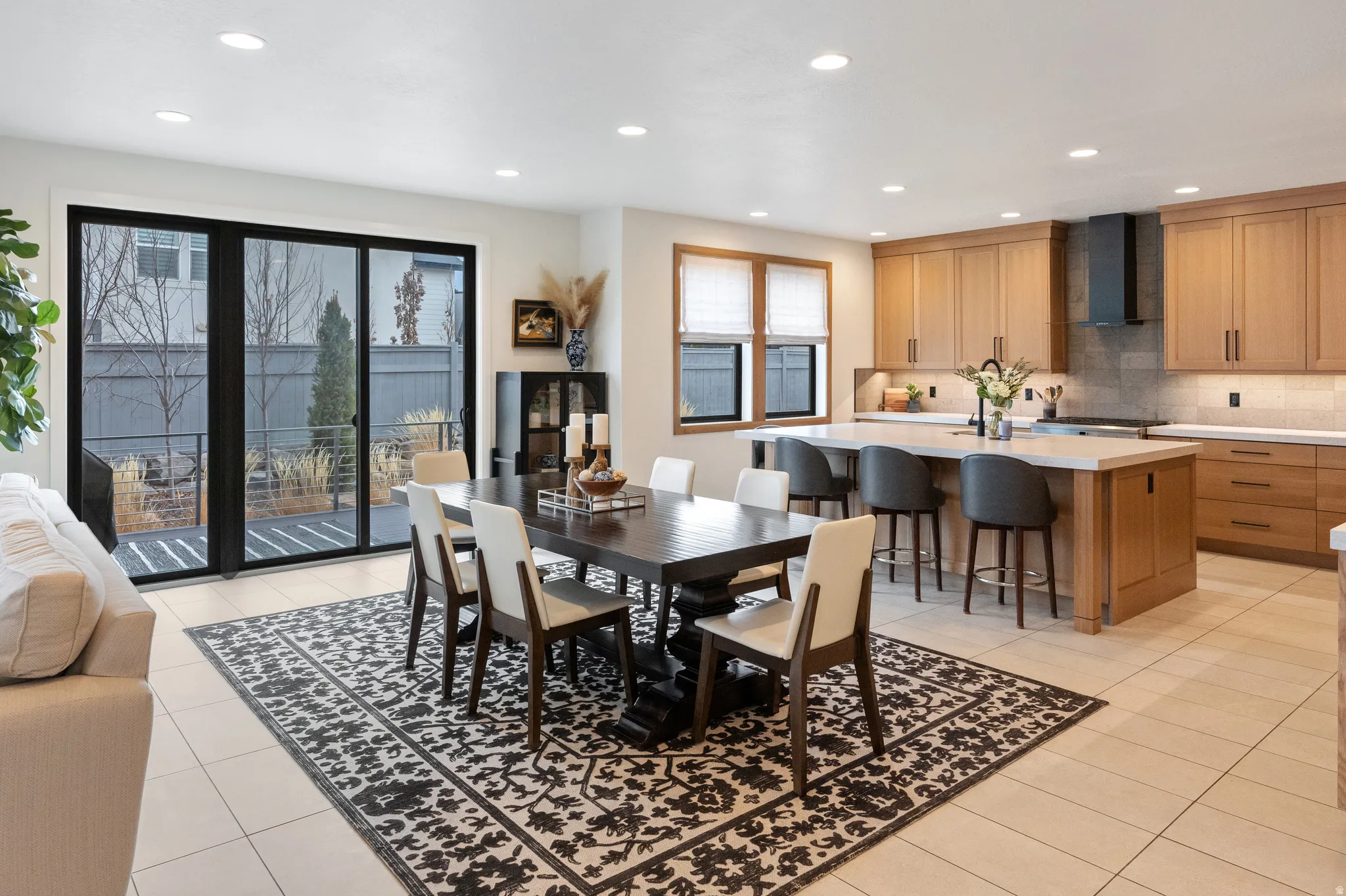 Dining area featuring recessed lighting and light tile patterned floors