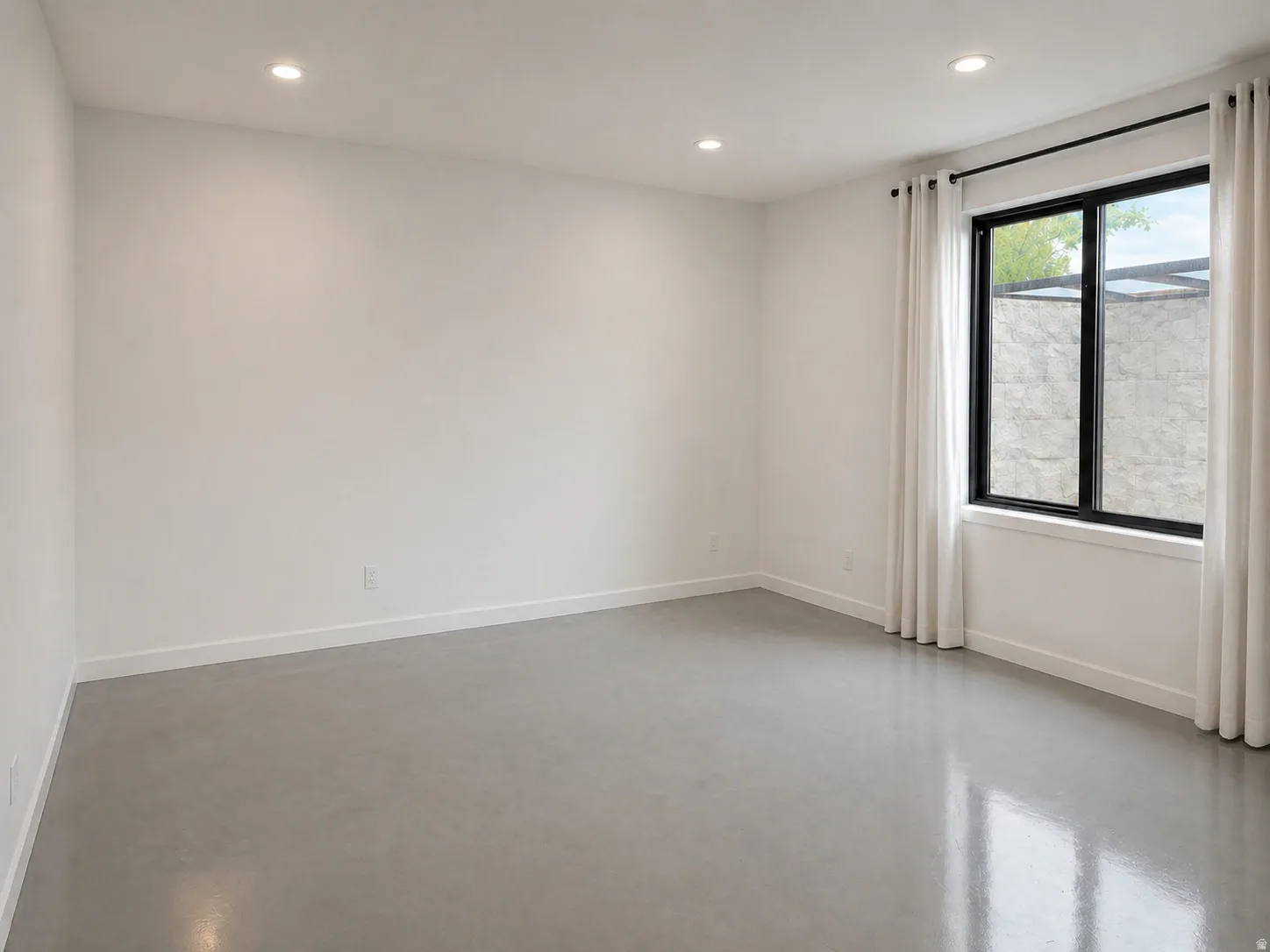 5th Bedroom featuring epoxy concrete floors and recessed lighting