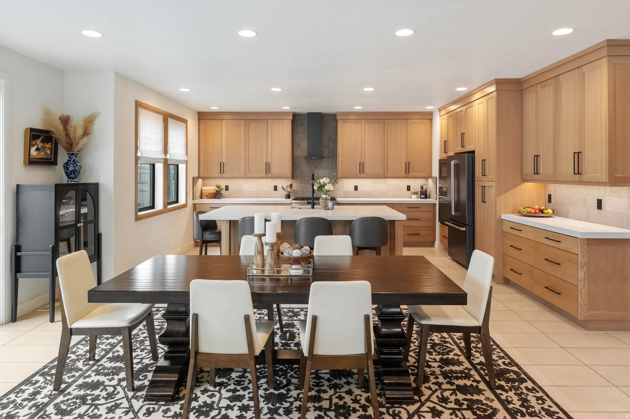 Dining room featuring light tile patterned floors and recessed lighting