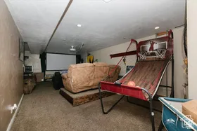 Game room with carpet floors and recessed lighting