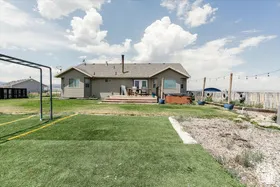 Back of property with a wooden deck
