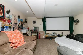 Carpeted home theater room featuring recessed lighting