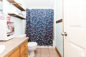 Bathroom with vanity and light tile patterned flooring