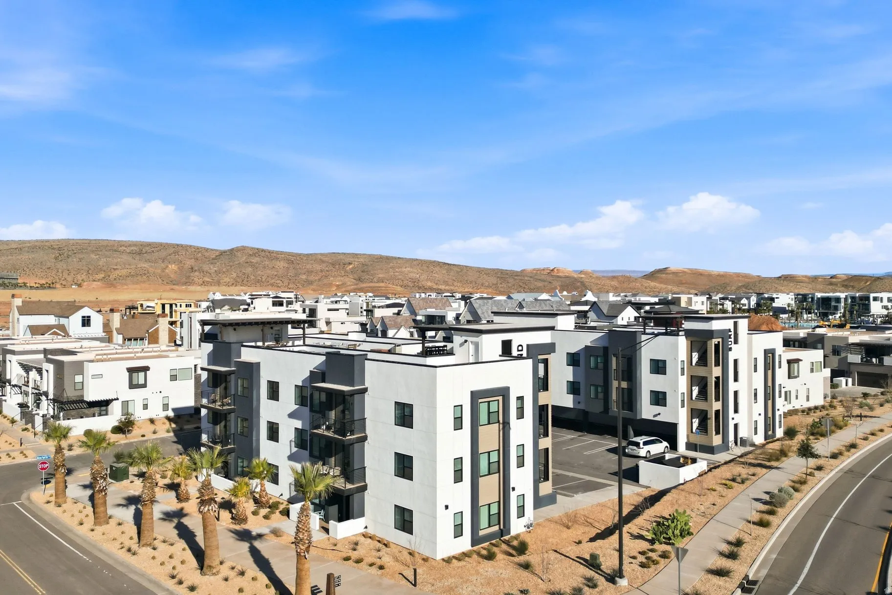 View of building exterior with a mountain view and a residential view