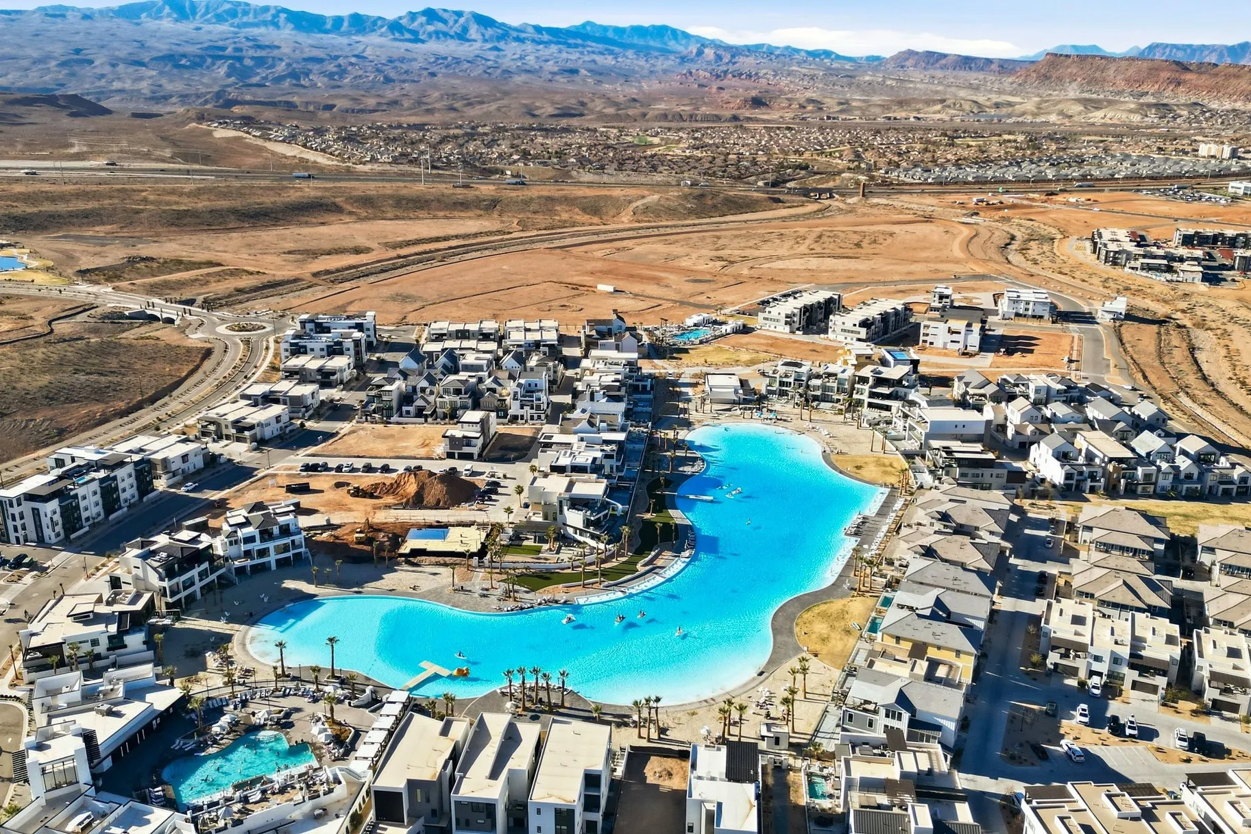 Bird's eye view of a mountain backdrop and a pool