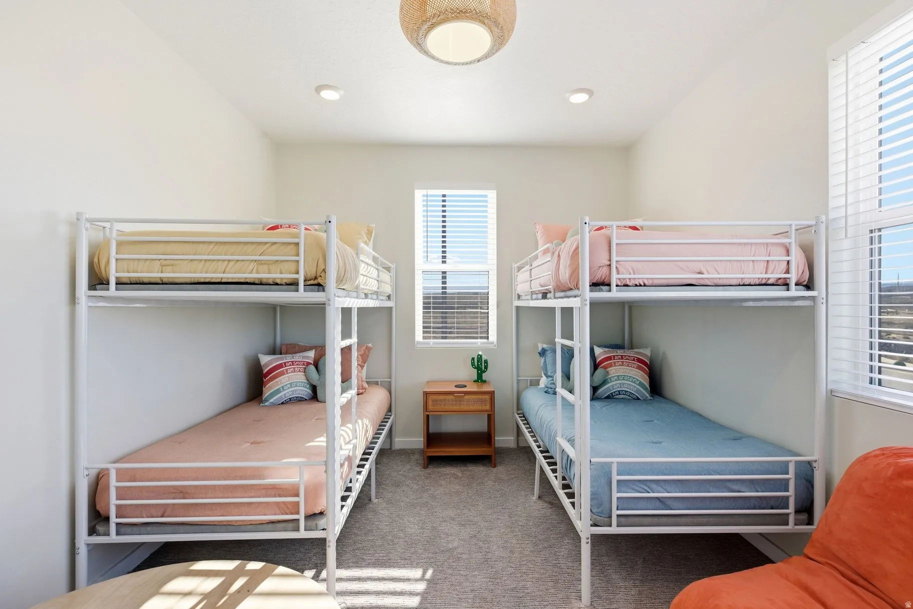 Bedroom with light carpet and baseboards