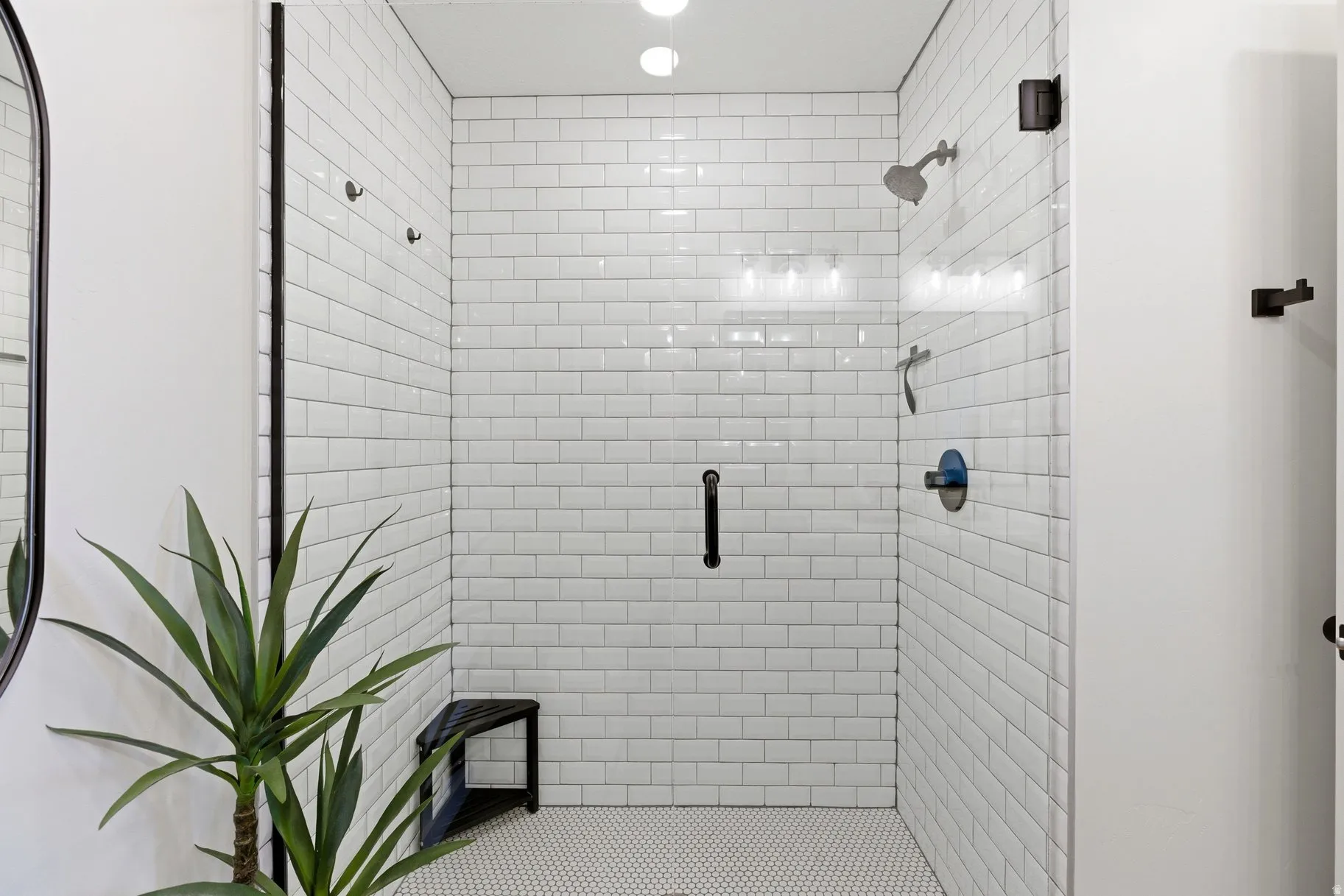 Full bath with a shower stall