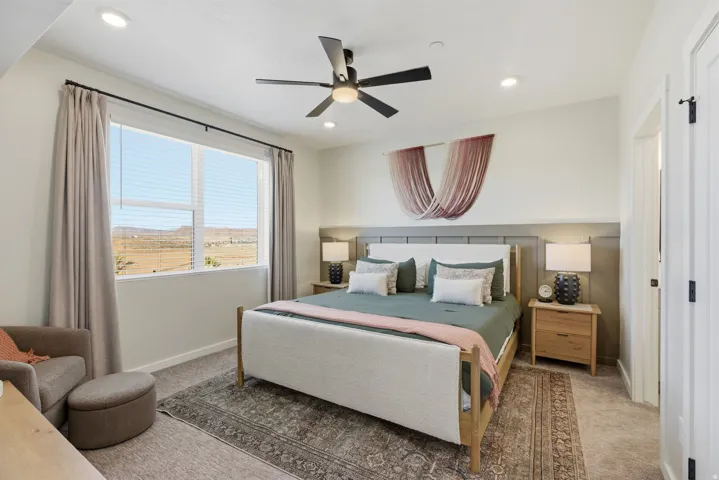 Bedroom with carpet floors, a ceiling fan, and recessed lighting