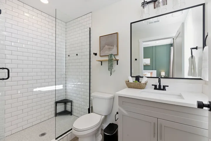Ensuite bathroom with vanity, a stall shower, and recessed lighting