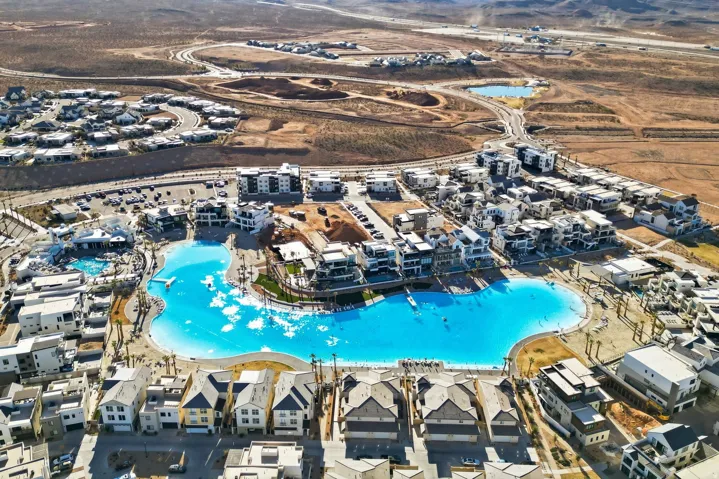 Aerial view of property's location featuring a pool area
