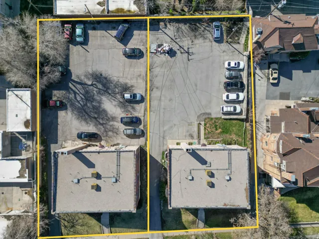 Aerial view of property and surrounding area featuring property parcel outlined