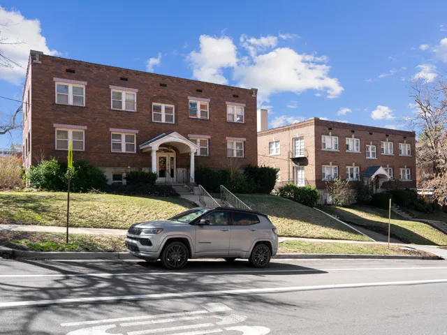 View of front of property with a front lawn and brick siding