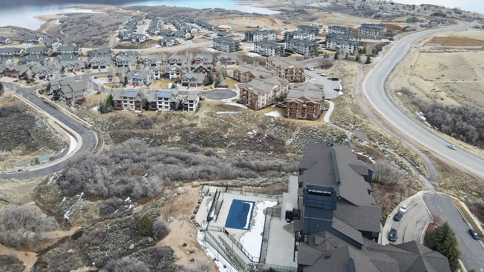 Aerial overview of property's location with nearby suburban area