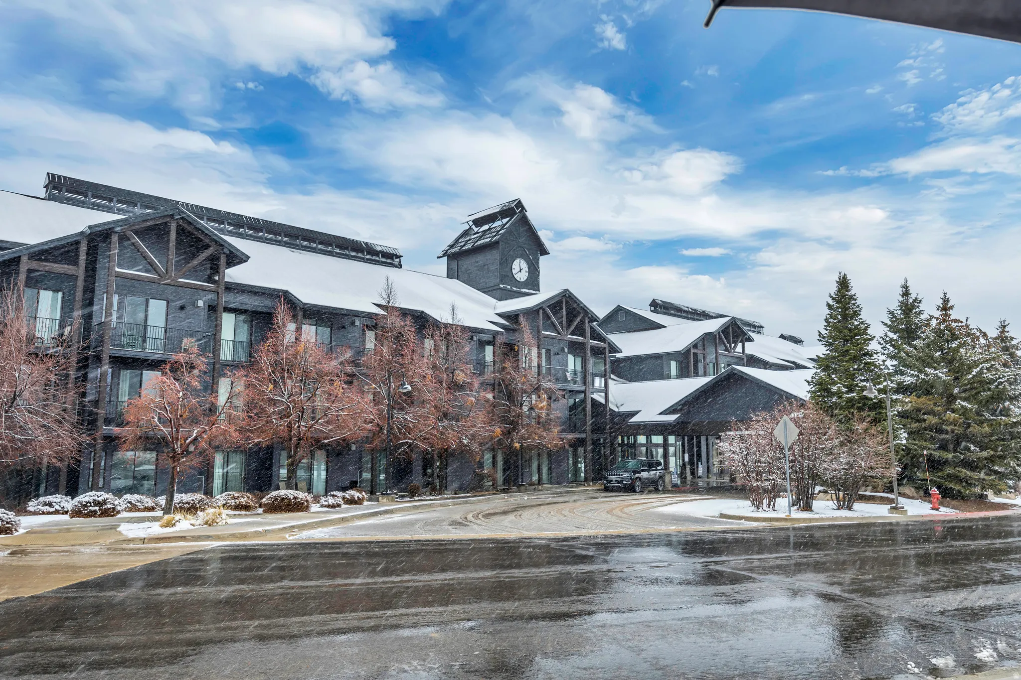 View of asphalt road with traffic signs and sidewalks