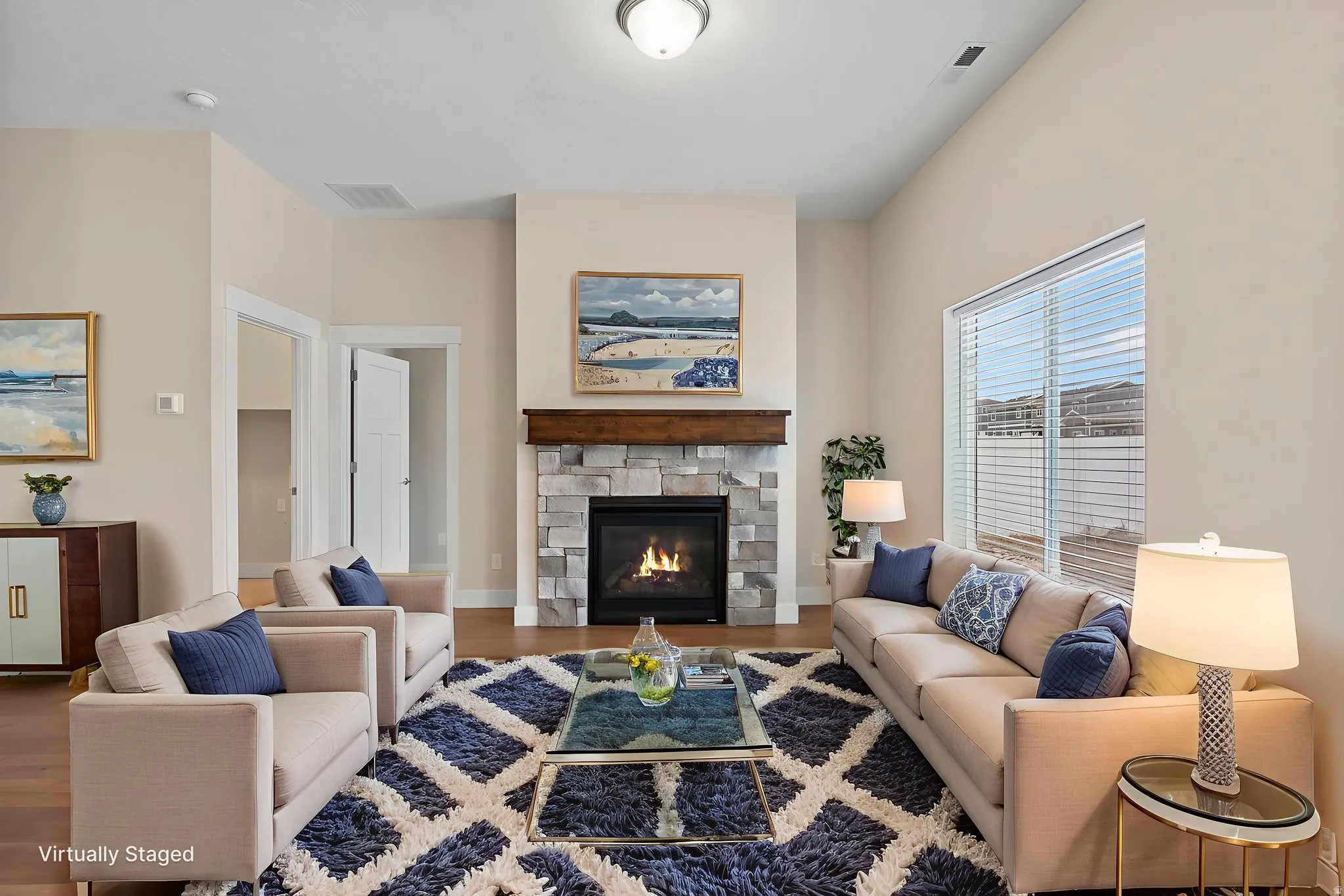 Living area featuring a fireplace and wood finished floors