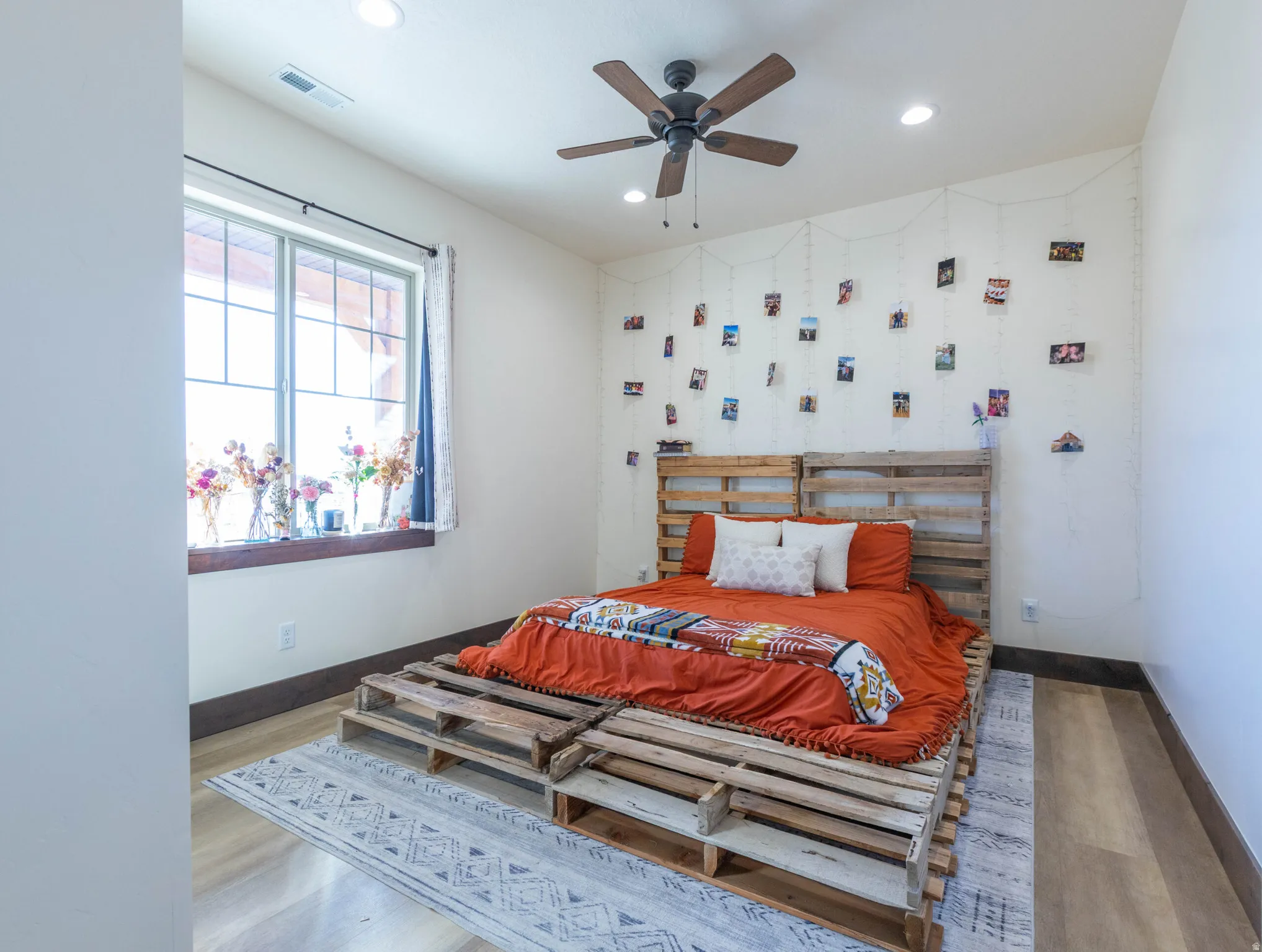 Bedroom featuring wood finished floors, recessed lighting, and a ceiling fan
