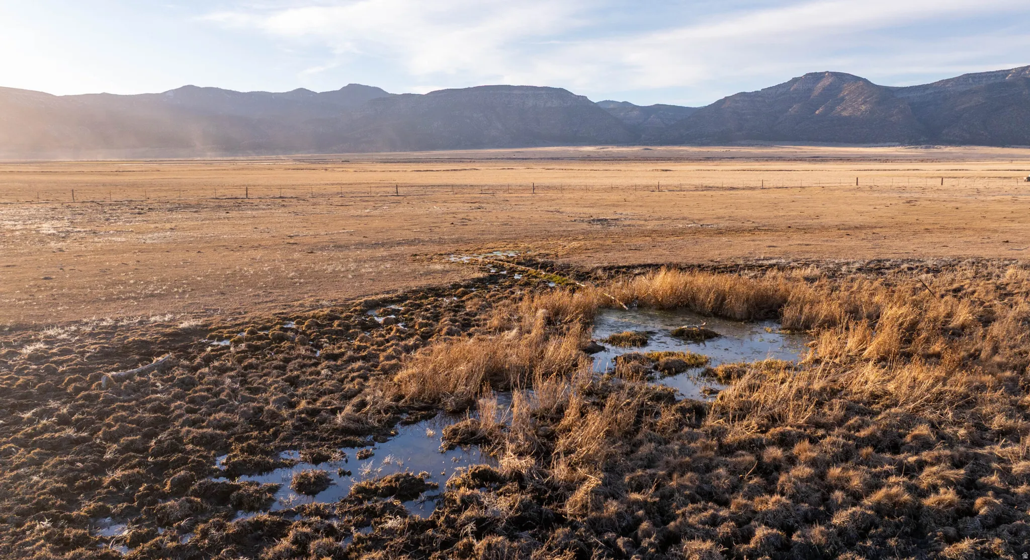 View of mountain backdrop with rural landscape