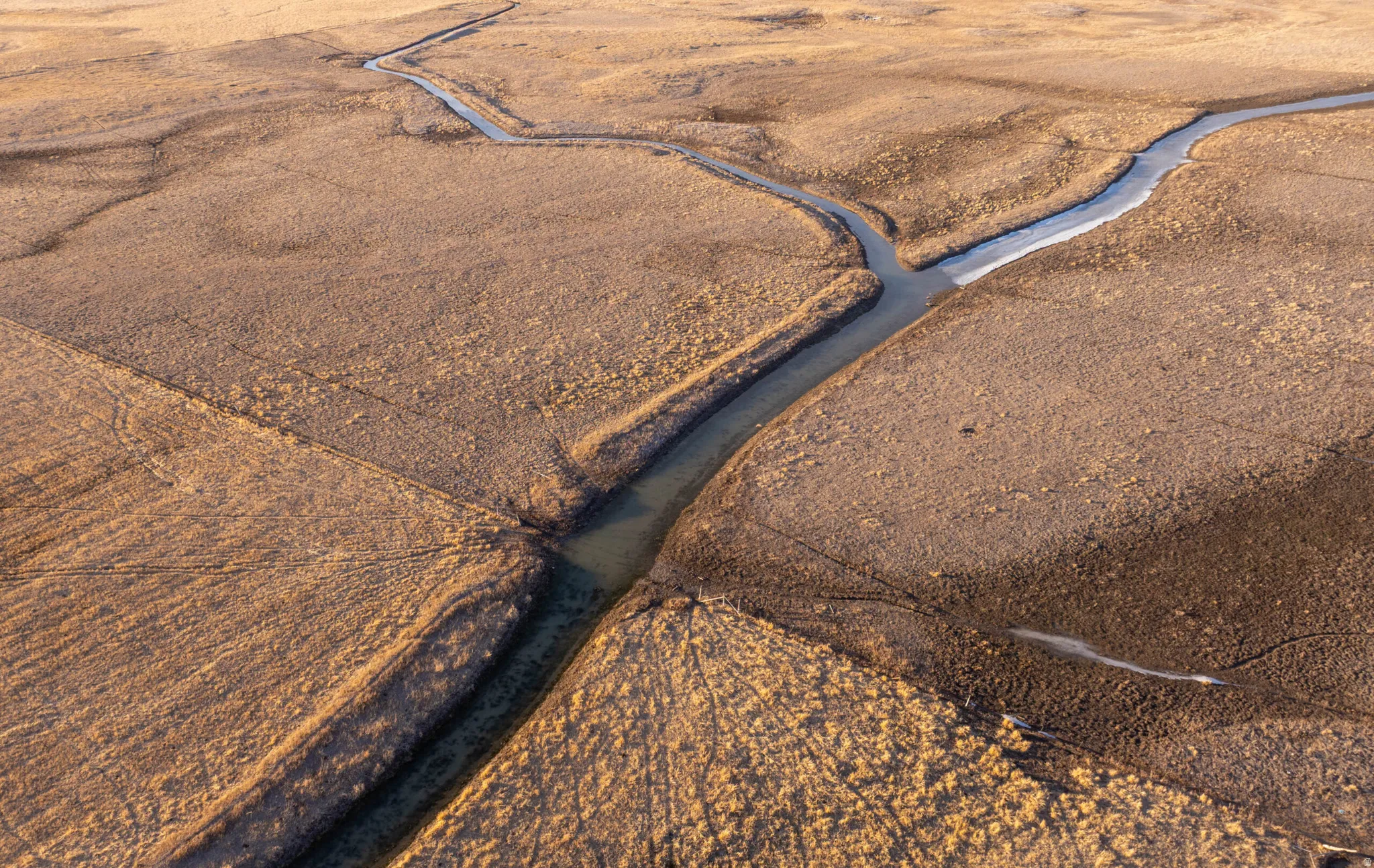 Aerial view of sparsely populated area with a desert landscape