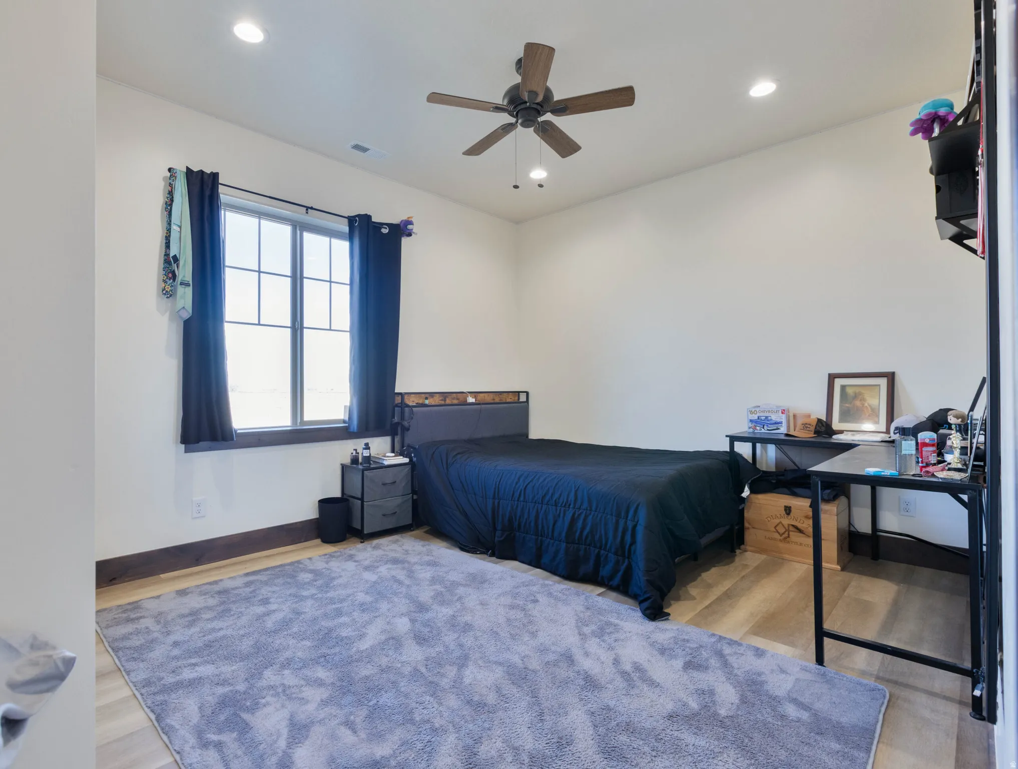 Bedroom featuring light wood finished floors, recessed lighting, and a ceiling fan