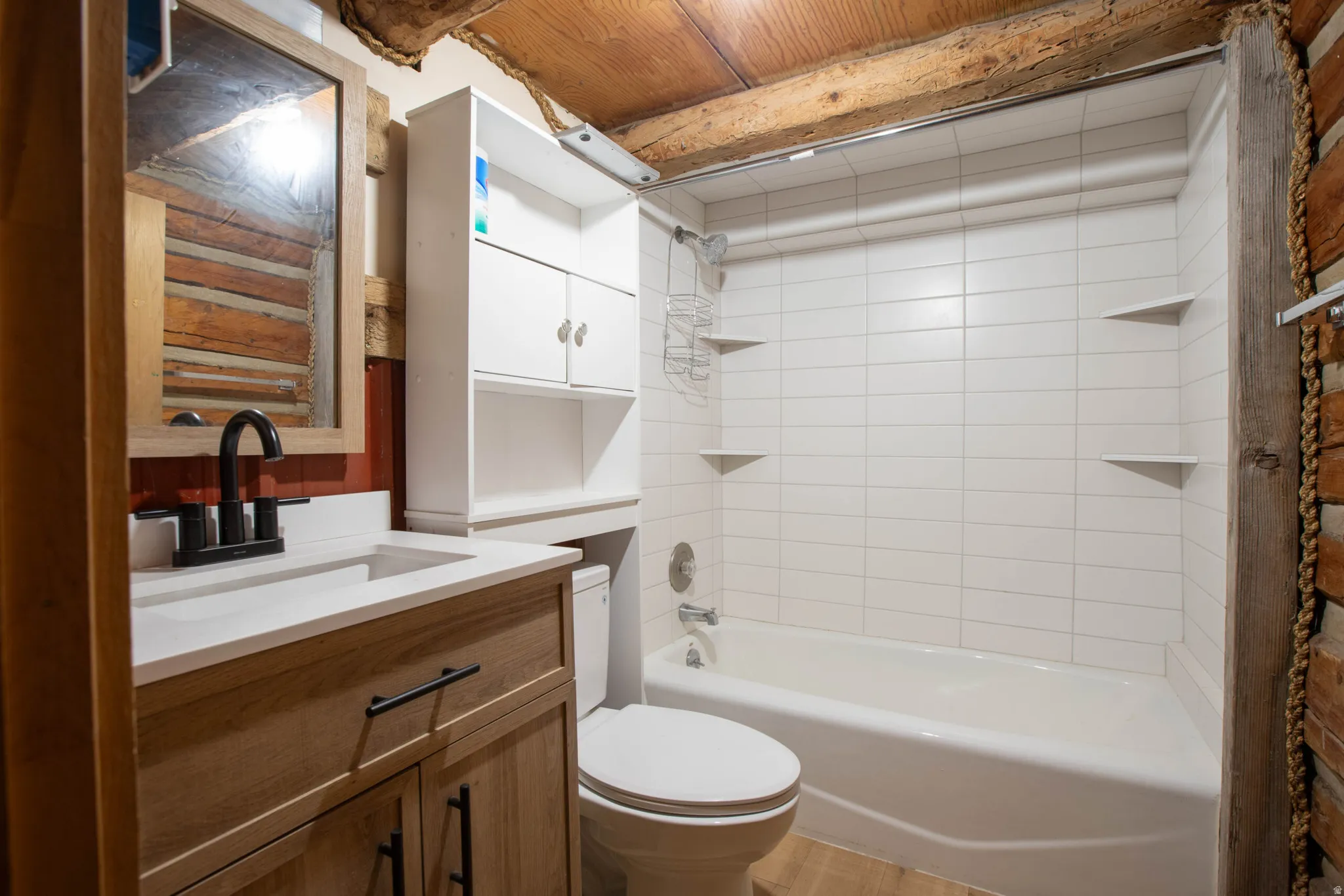 Bathroom with shower / washtub combination and vanity