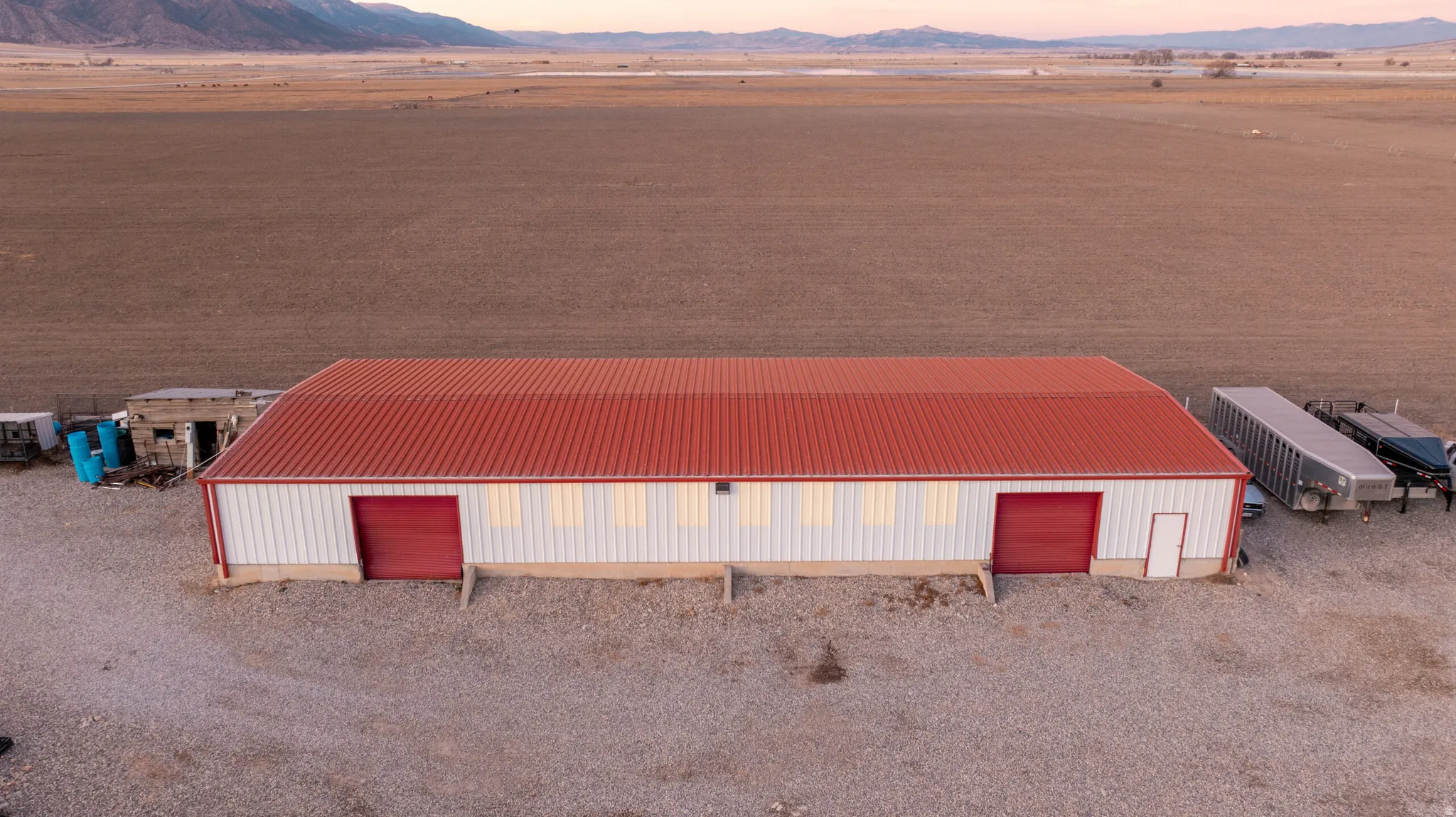 View of pole building with a mountain view