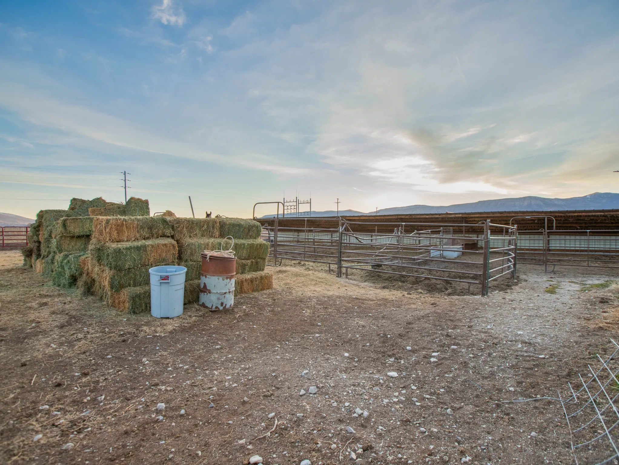 View of yard with a view of rural / pastoral area, an outbuilding, an exterior structure, and a mountain view