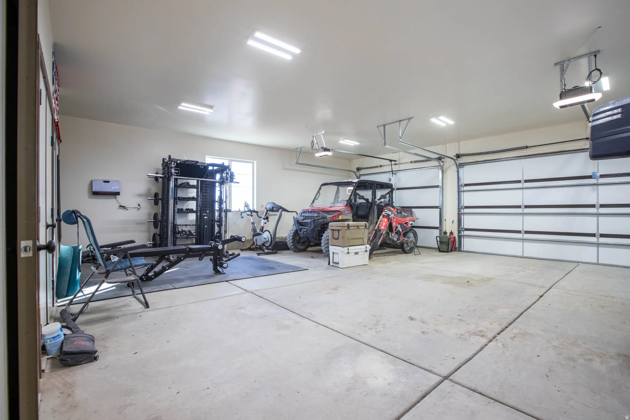 Garage featuring a garage door opener