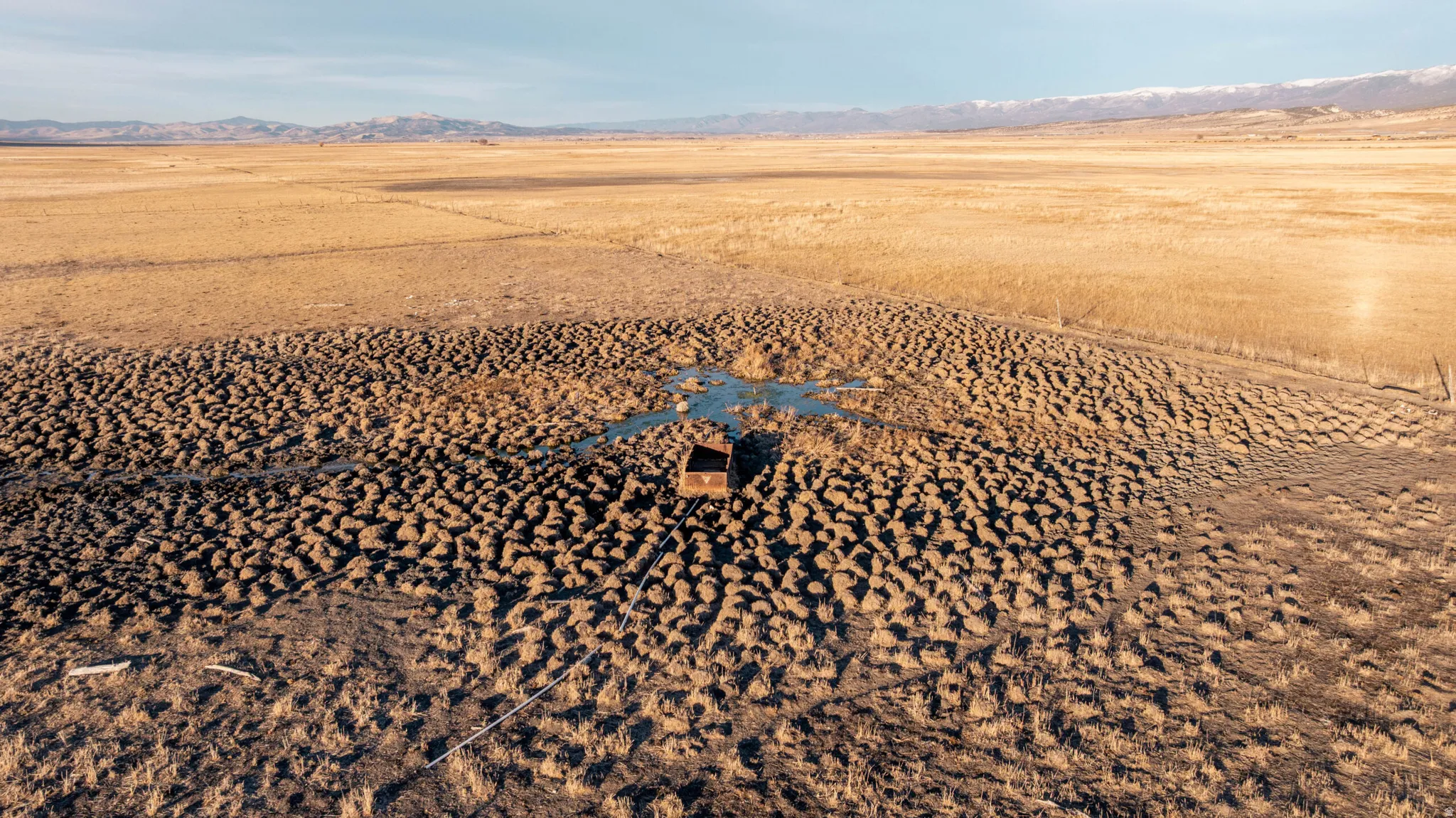 Aerial view of sparsely populated area with a mountainous background