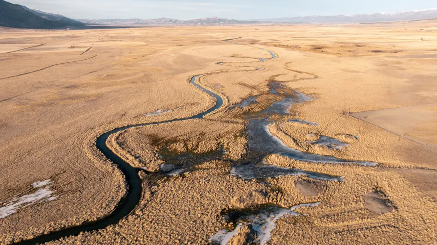 Overview of rural landscape with a mountainous background
