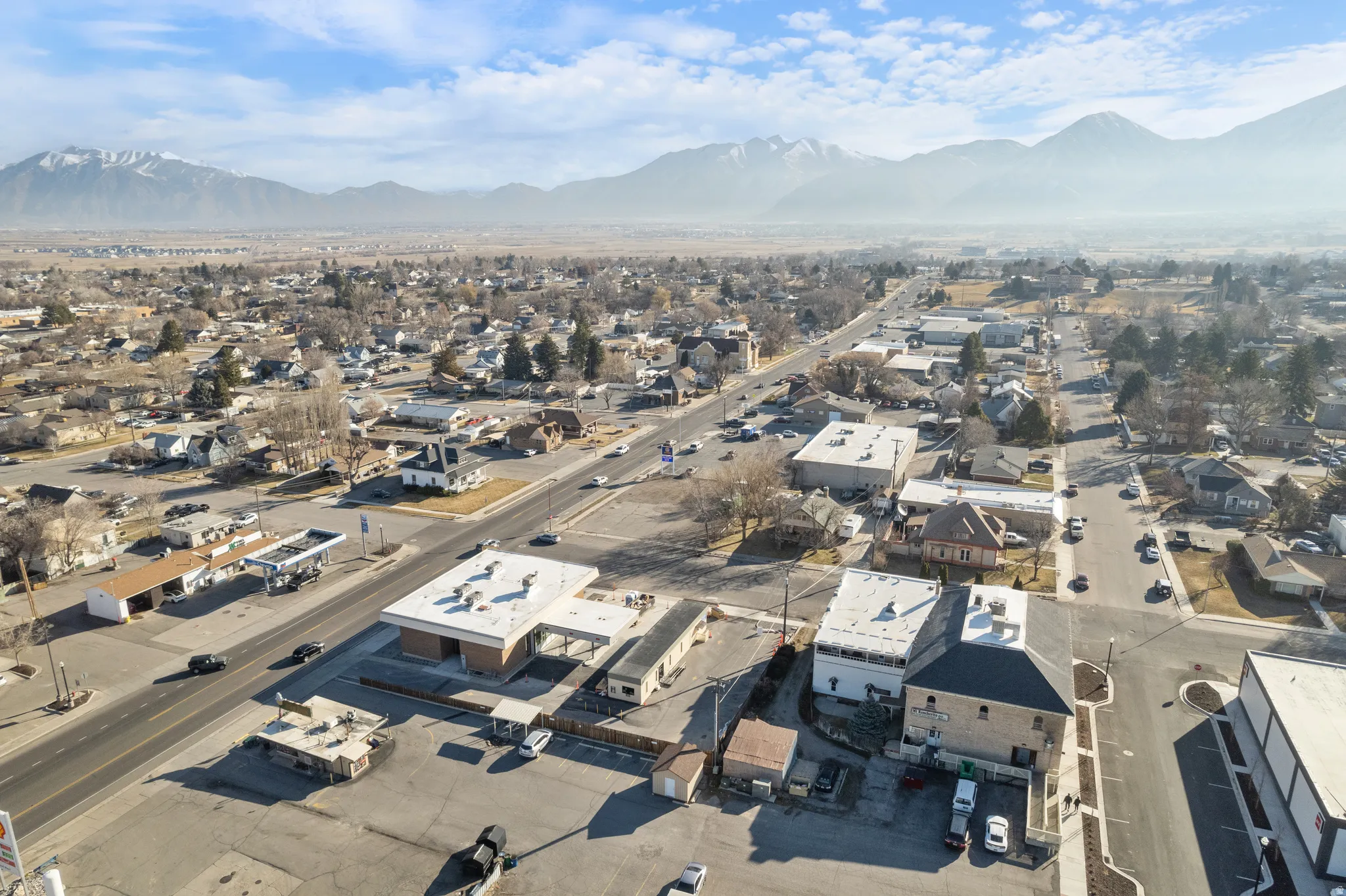 Aerial perspective of suburban area featuring a mountain backdrop