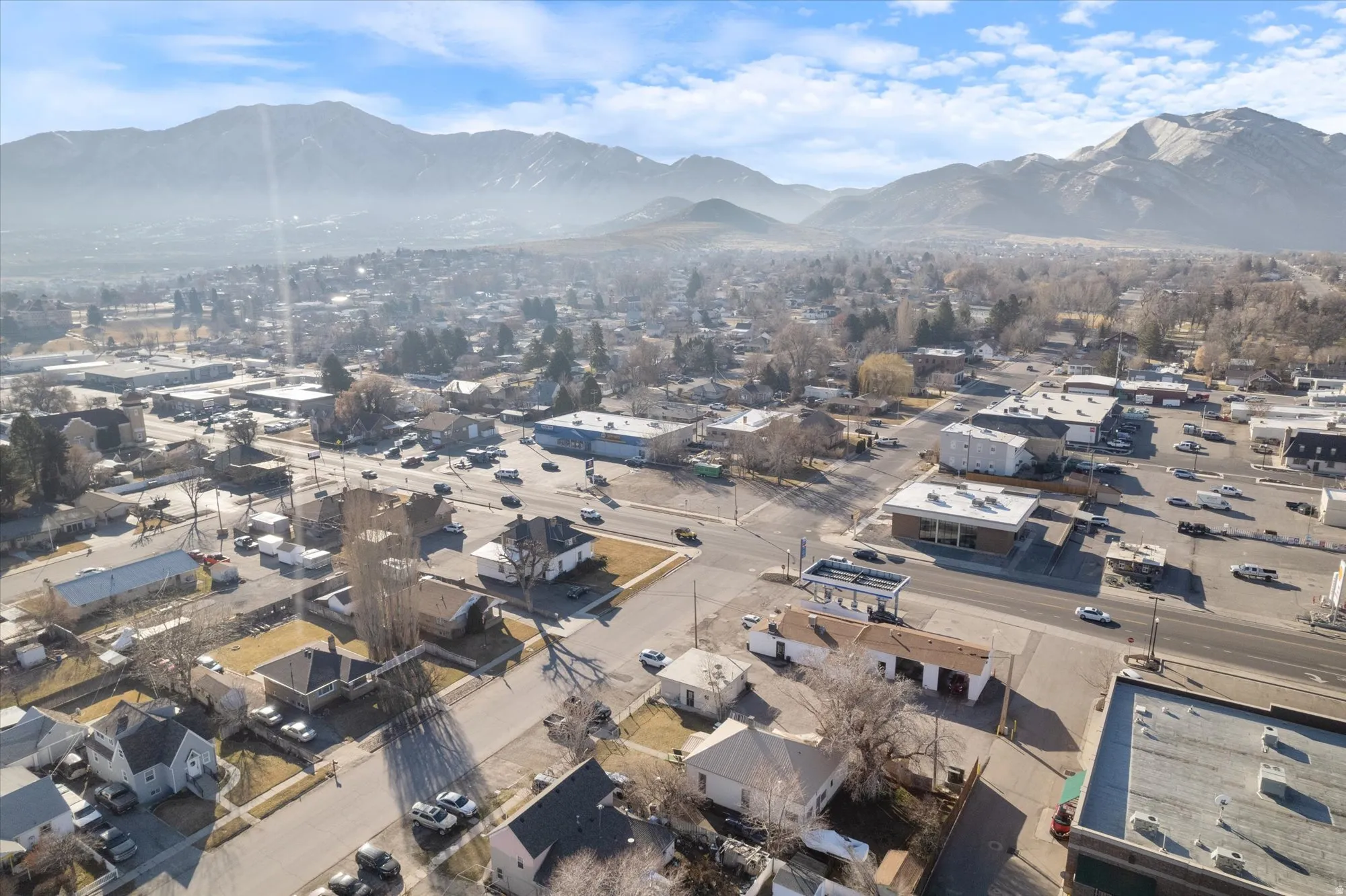 Aerial view of residential area featuring a mountain backdrop