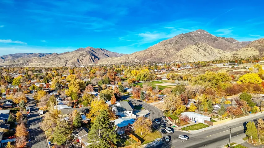 Aerial view of residential area featuring a mountainous background
