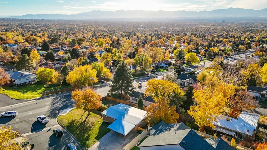 Aerial perspective of suburban area with a mountain backdrop