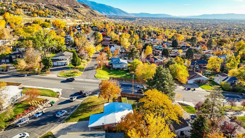 Aerial perspective of suburban area featuring a mountainous background