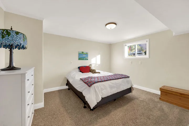 Bedroom featuring carpet flooring and ornamental molding