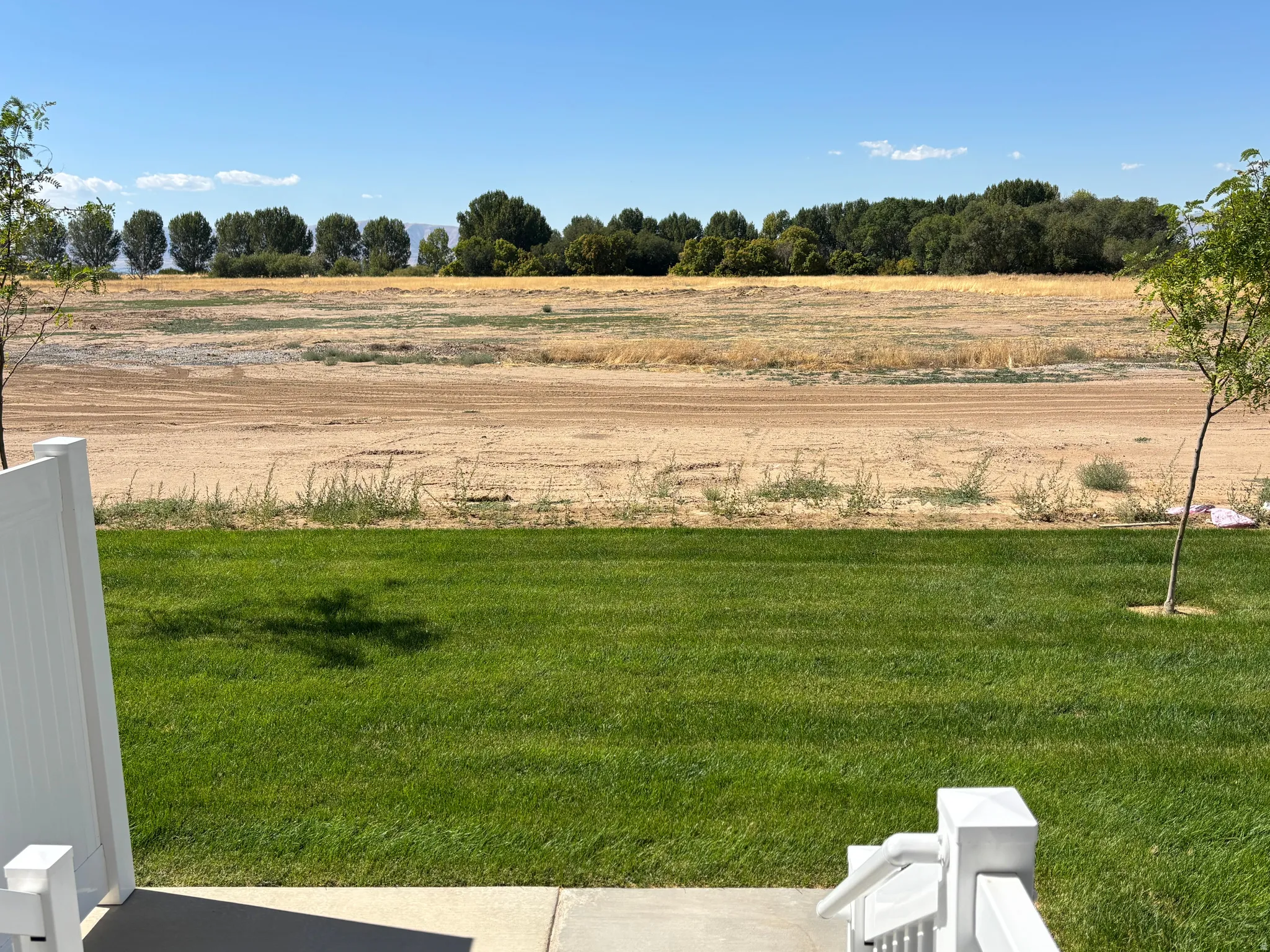 View of yard with a rural view