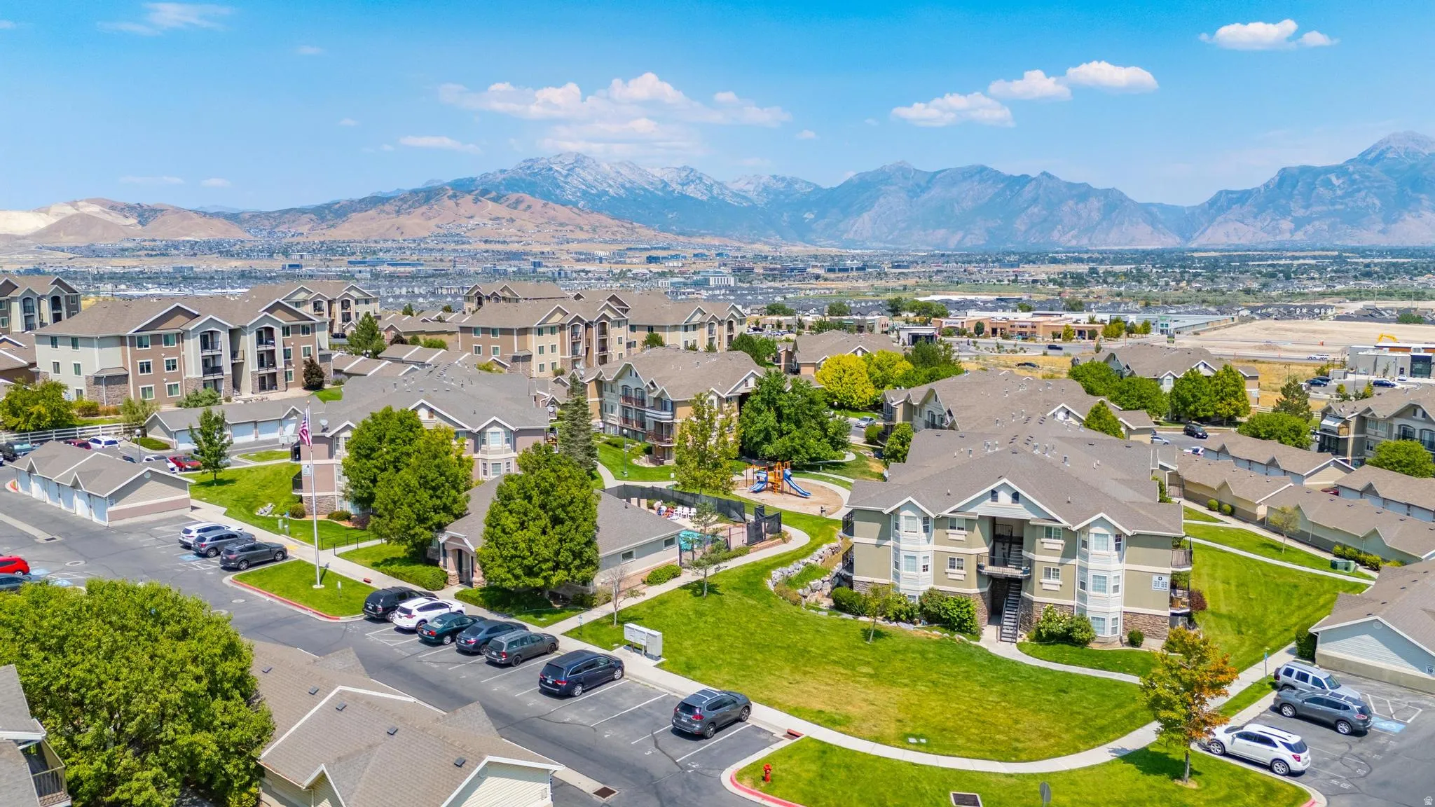 Aerial perspective of suburban area featuring a mountain backdrop