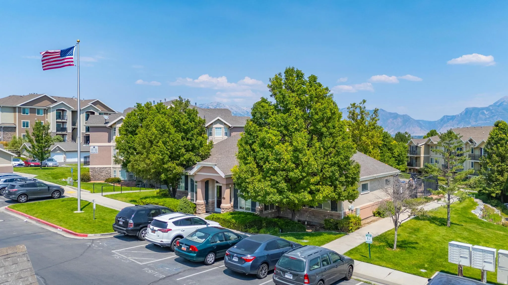 View of property featuring uncovered parking, a mountain view, and a residential view