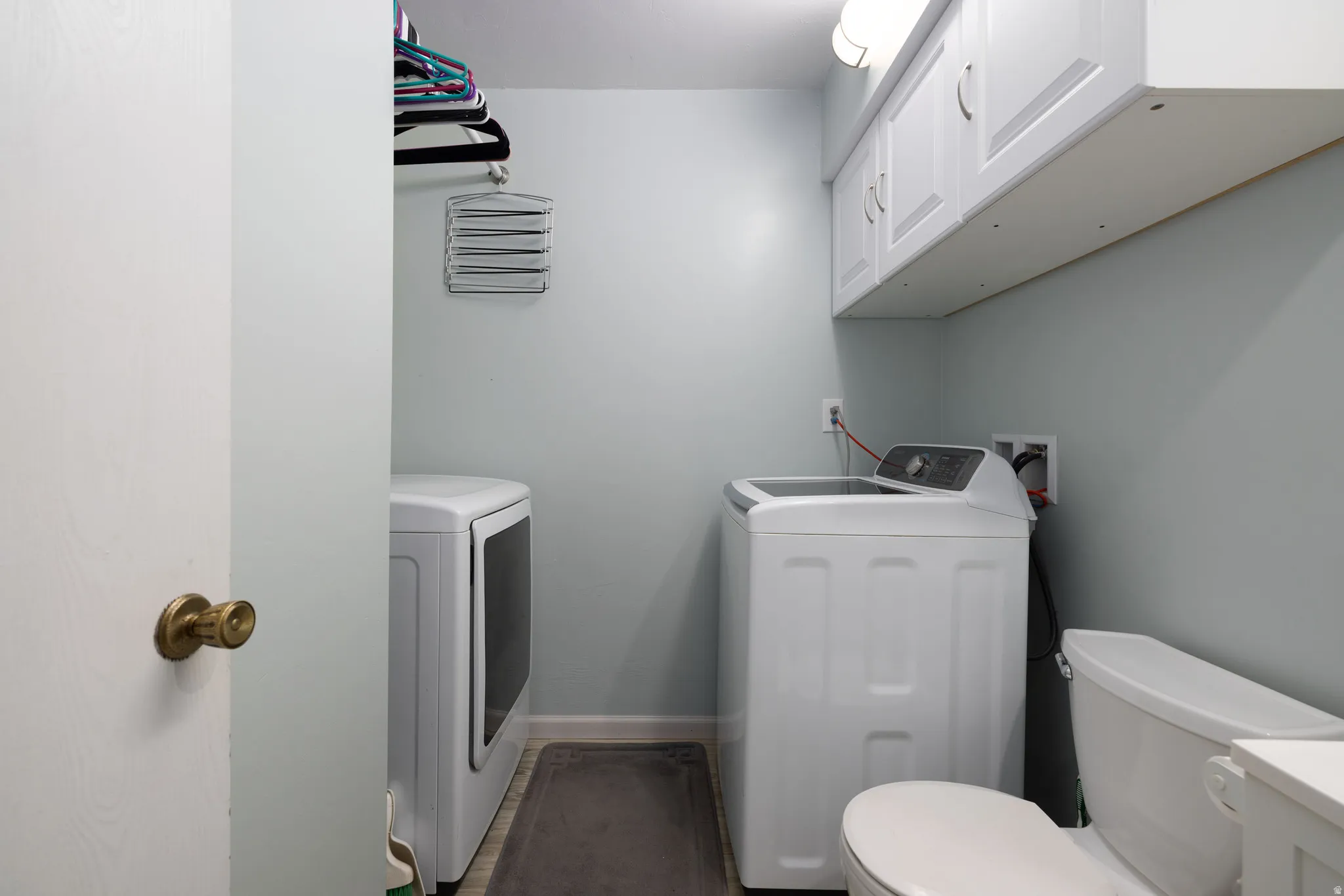 Half Bathroom with independent washer and dryer and vanity