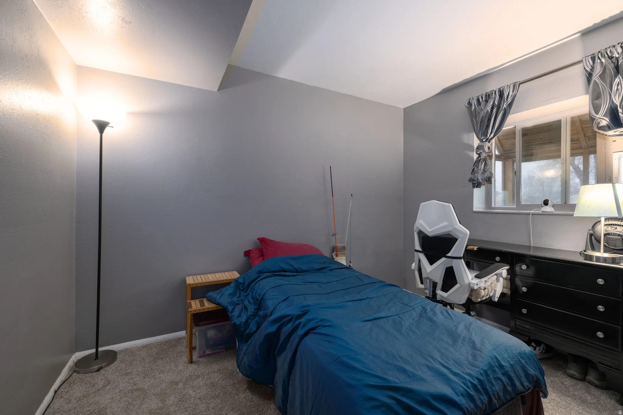 Bedroom featuring new light colored carpet and baseboards