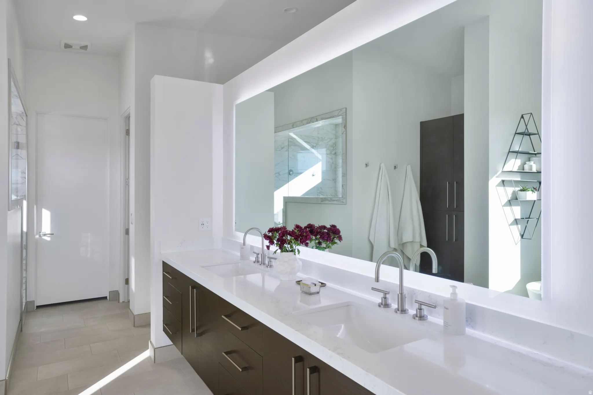 Bathroom featuring double vanity and toilet