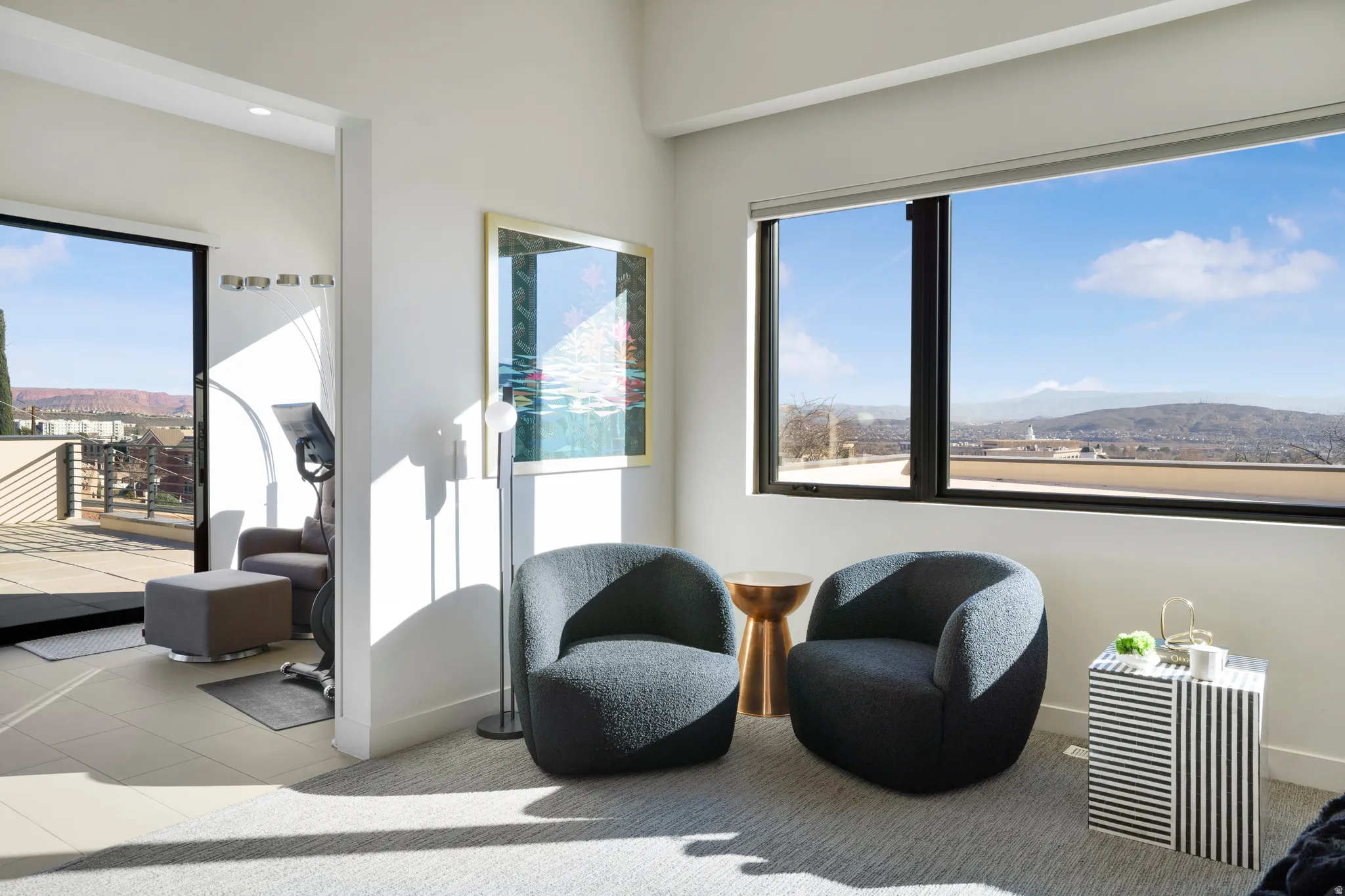 Living area featuring a mountain view and tile patterned flooring