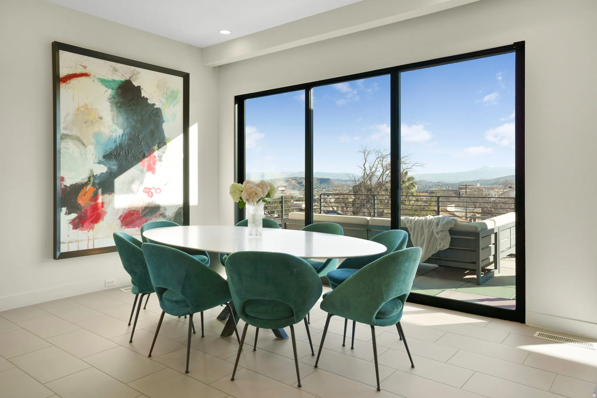 Dining area featuring baseboards and a mountain view
